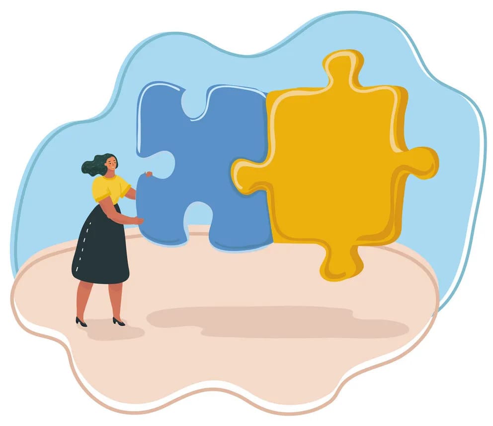 A woman is holding up two pieces of puzzle.